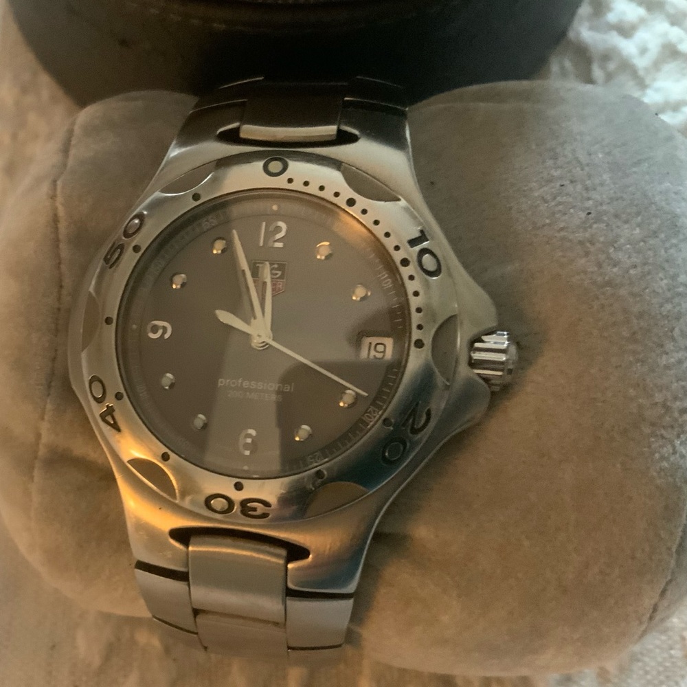 Tag Heuer stainless steel men’s watch.(needs new battery)